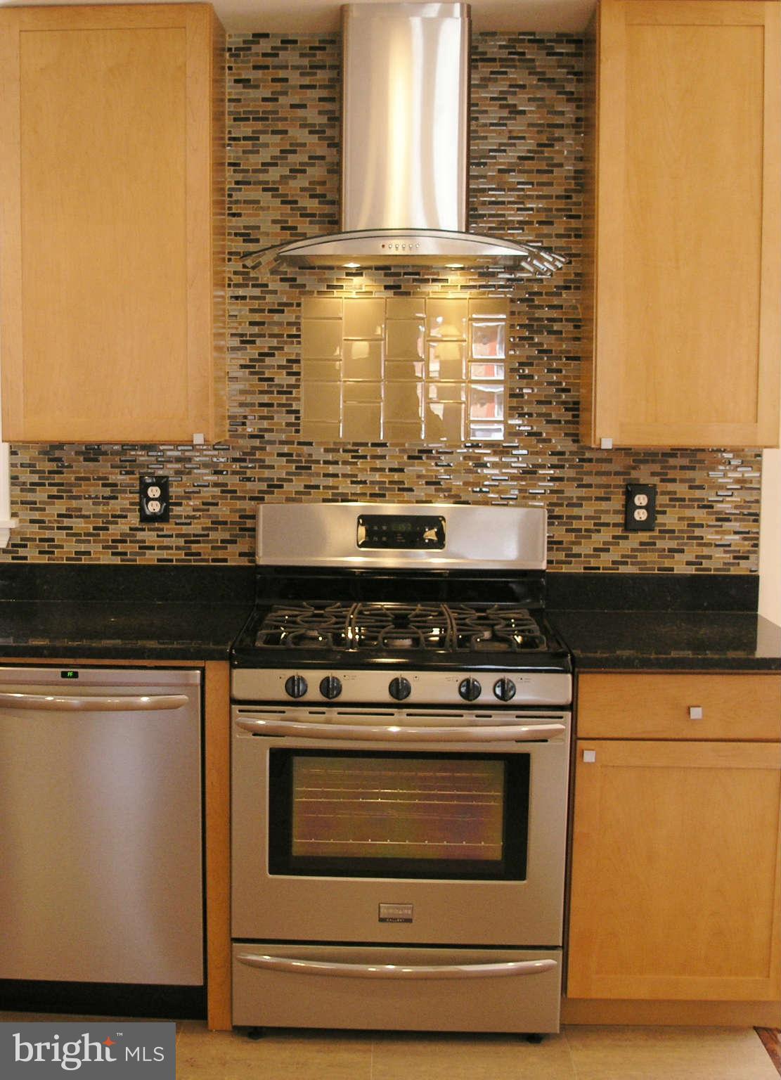 2011 Cascade Road Silver Spring, MD 20902 - Photo 10 of 24 a stove top oven sitting inside of a kitchen