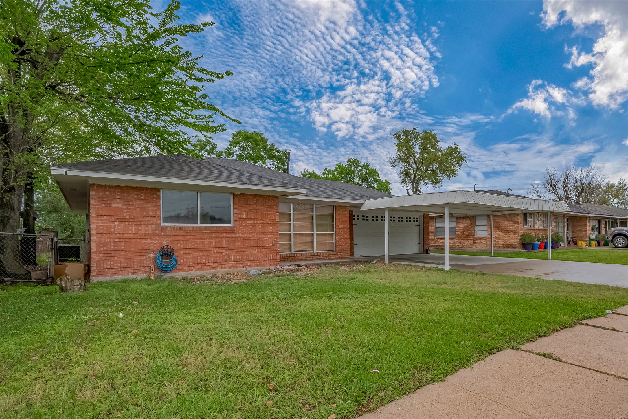 626 Shawnee Street Houston, TX 77034 - Photo 15 of 16 a front view of a house with a garden