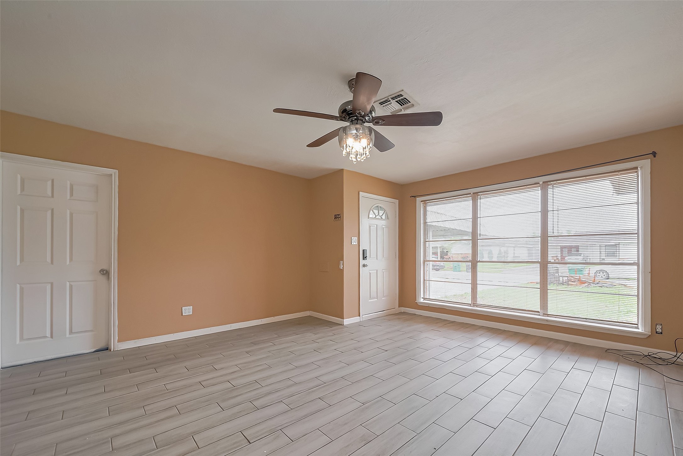626 Shawnee Street Houston, TX 77034 - Photo 4 of 16 a view of an empty room with a window