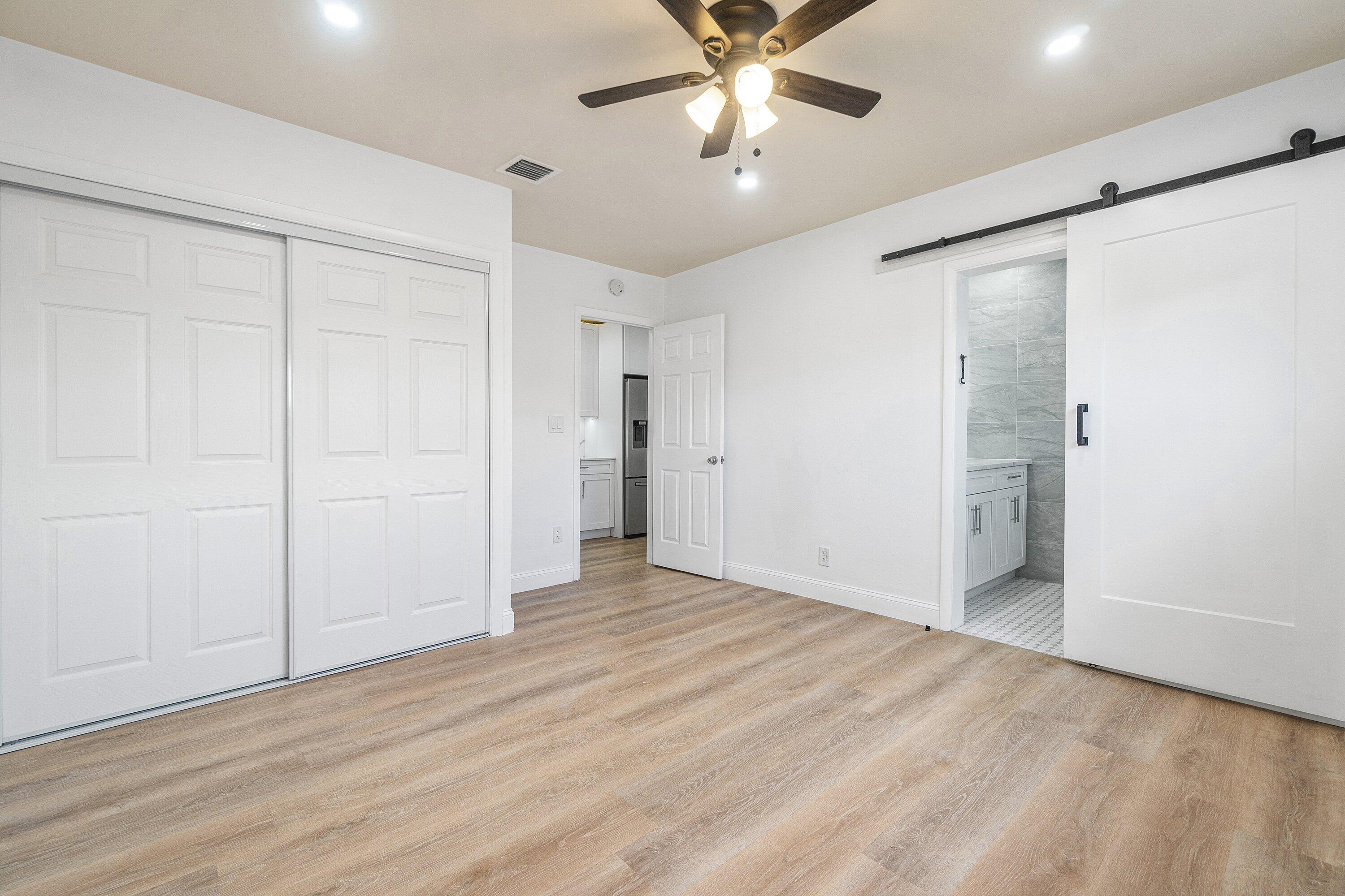 434 Southwest 9th Street, Unit A Boca Raton, FL 33432 - Photo 14 of 22 a view of an empty room with wooden floor