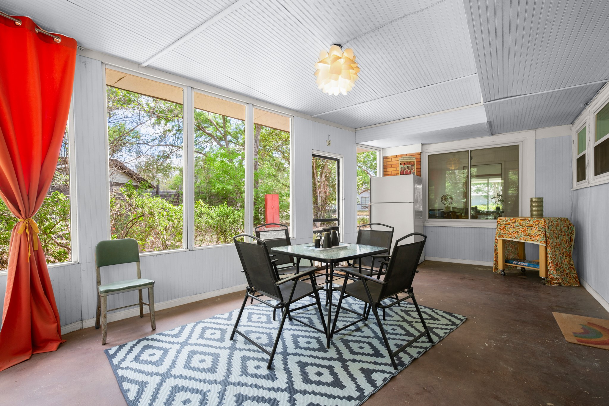 4702 Lasso Path Austin, TX 78745 - Photo 11 of 31 Sunroom featuring outdoor dining area