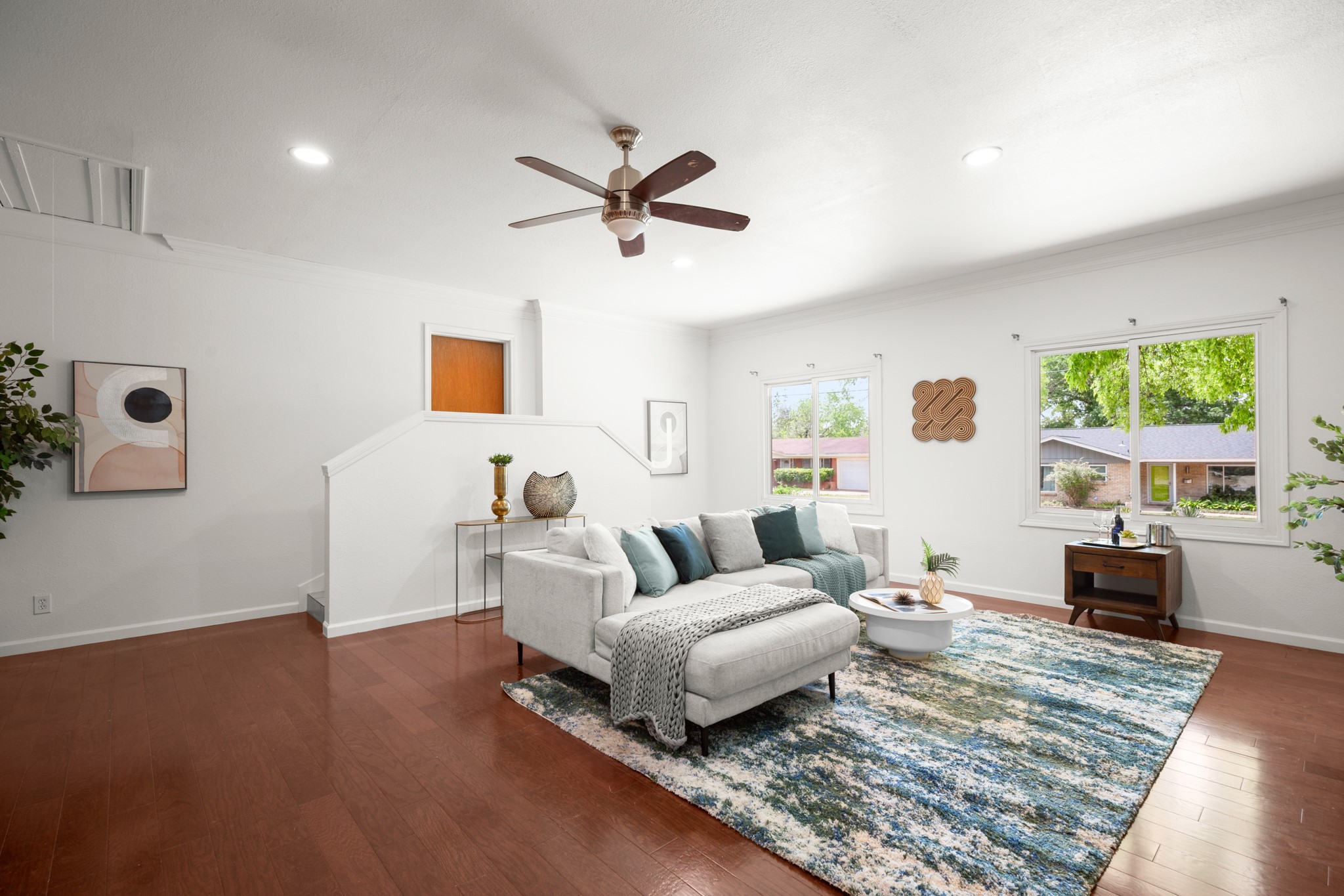 4702 Lasso Path Austin, TX 78745 - Photo 17 of 31 Living area featuring a ceiling fan, dark wood-type flooring, recessed lighting, and crown molding