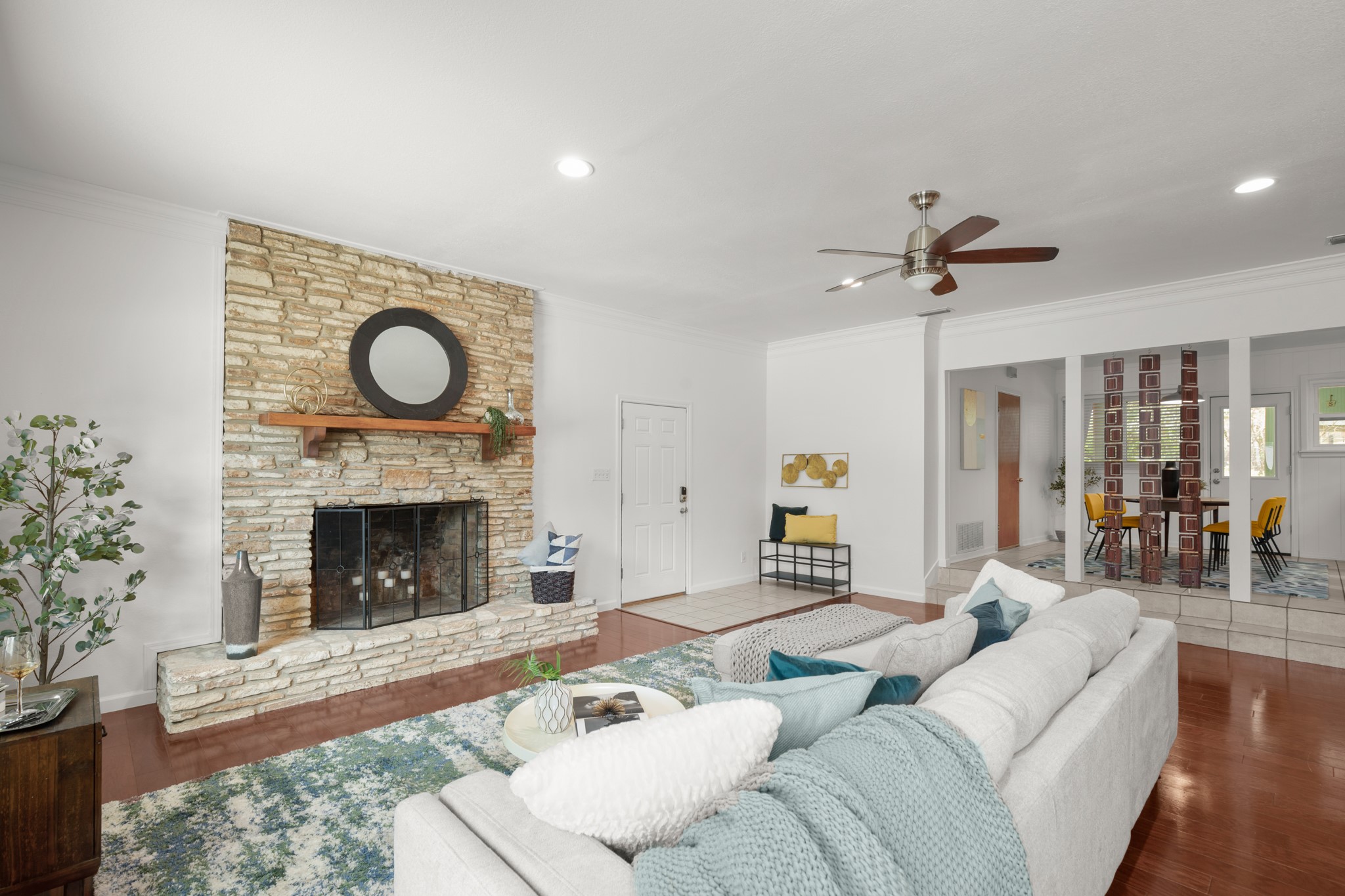 4702 Lasso Path Austin, TX 78745 - Photo 19 of 31 Living area featuring ornamental molding, a fireplace, ceiling fan, wood finished floors, and recessed lighting