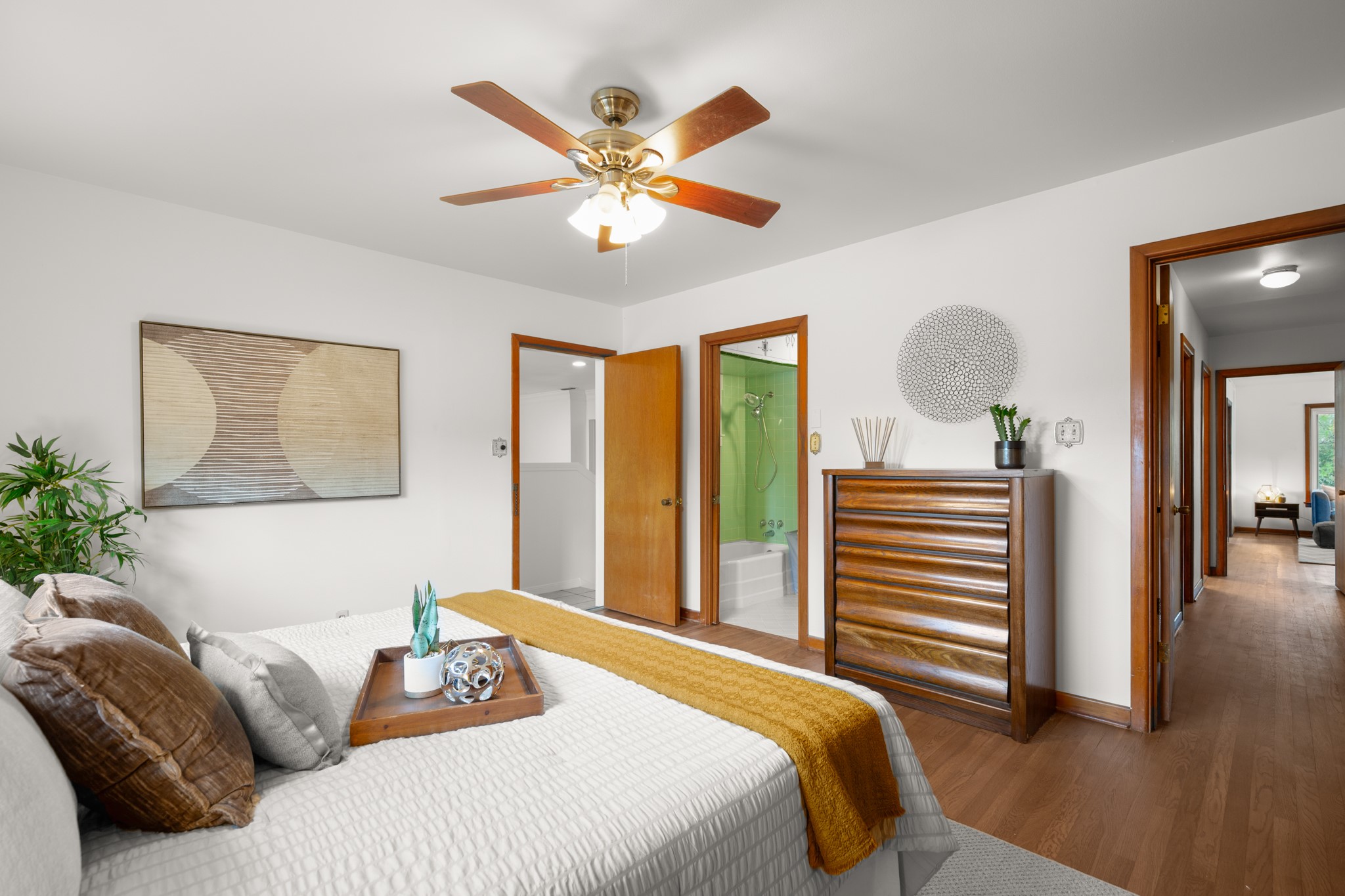 4702 Lasso Path Austin, TX 78745 - Photo 22 of 31 Bedroom featuring wood finished floors, ensuite bath, and ceiling fan