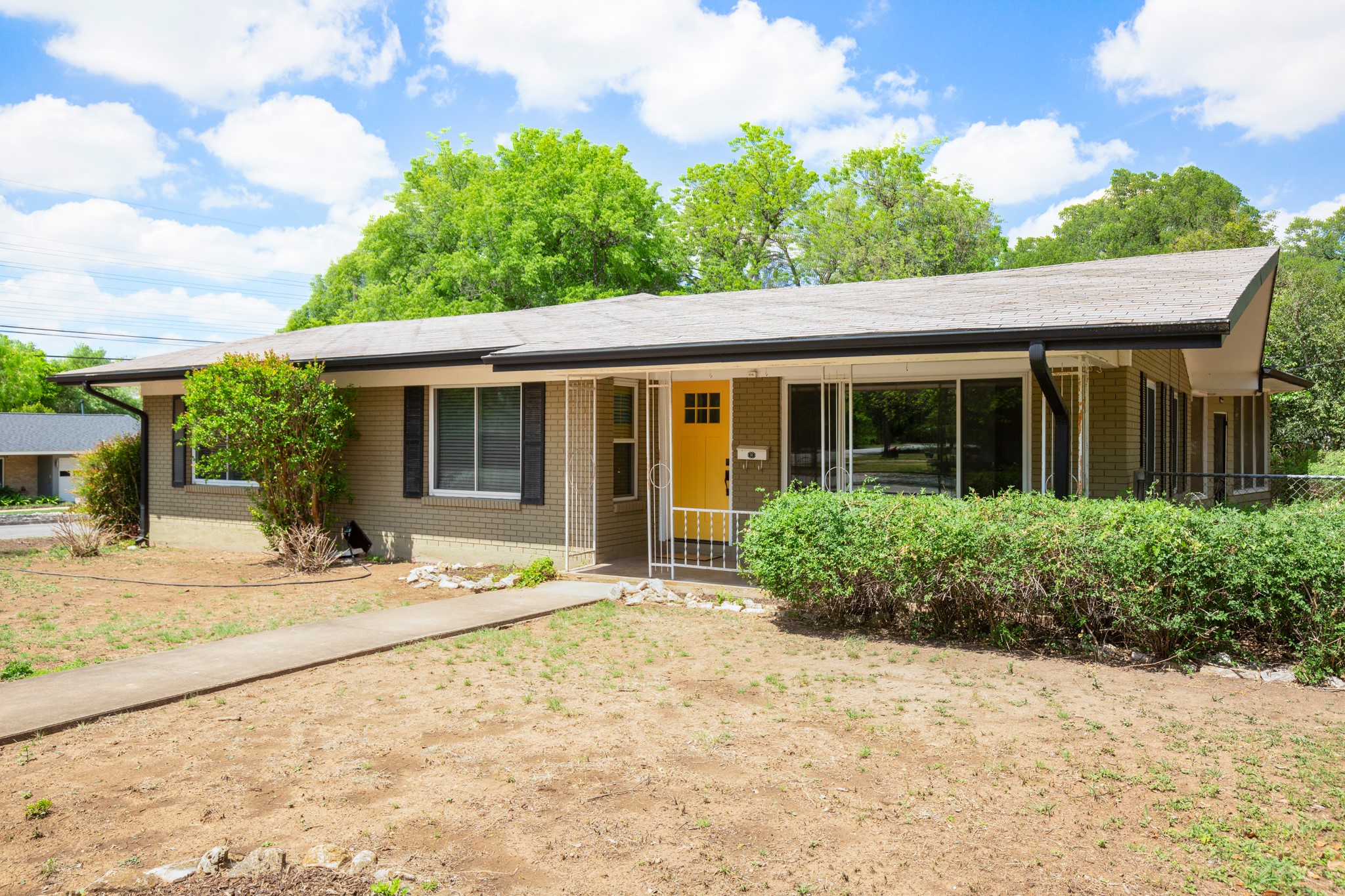 4702 Lasso Path Austin, TX 78745 - Photo 28 of 31 Ranch-style home featuring a porch and brick siding