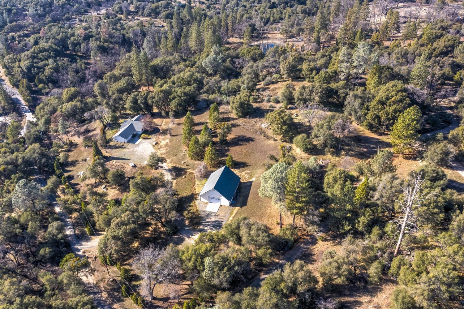 4536 Usona Road Mariposa, CA 95338 - Photo 50 of 54 Over 8 acres of beautiful land. Views, meadows, green trees with the Chowchilla River on 1/3 of it's border. Homes are set a nice distance apart and have their own separate driveways. Lots of room to park or have horses.