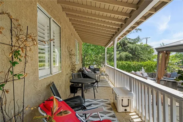a view of balcony with furniture