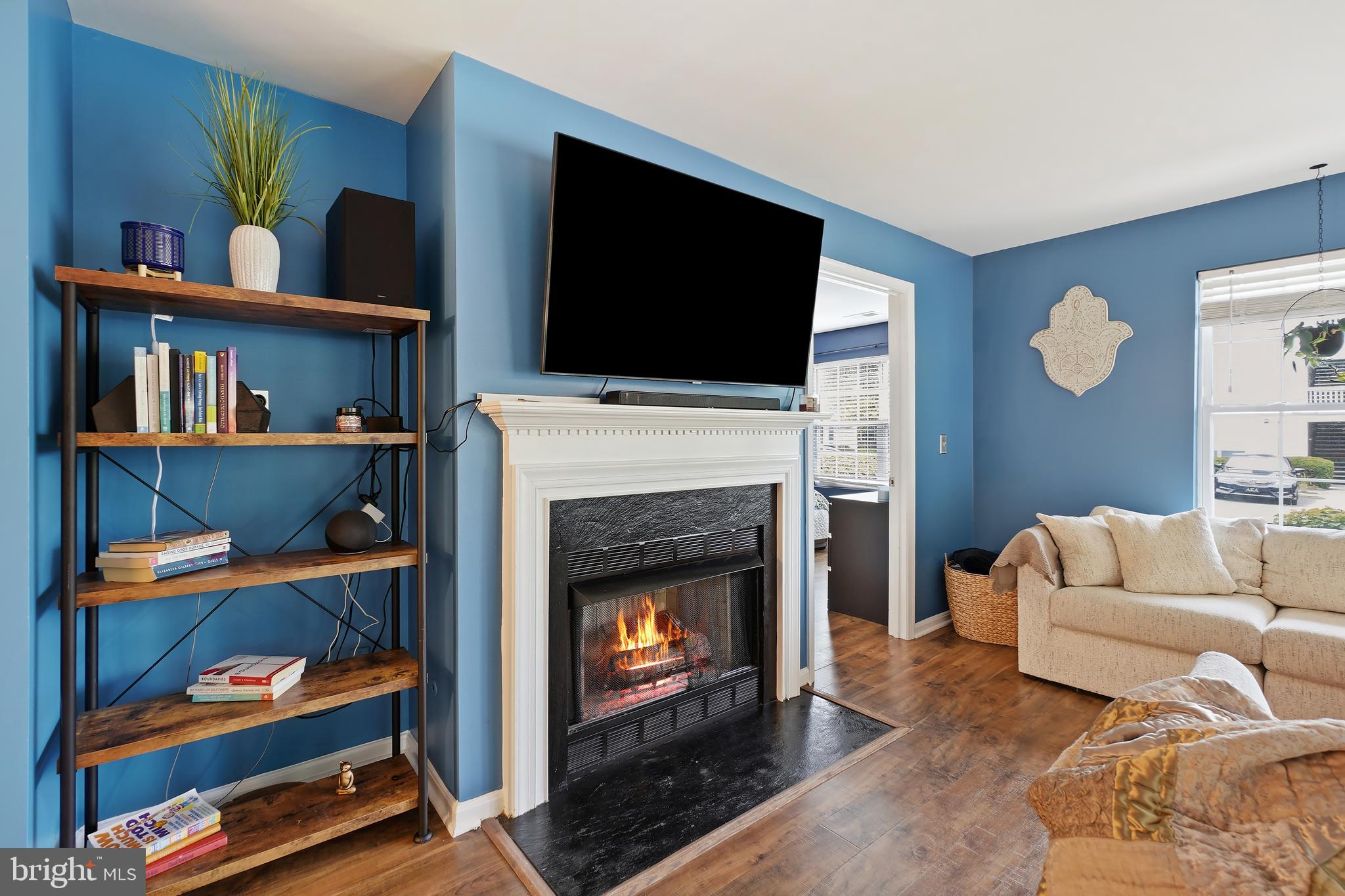 14151 Cuddy Loop, Unit 101 Woodbridge, VA 22193 - Photo 7 of 45 a living room with furniture and a fireplace