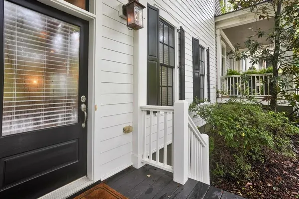 a view of a house with a door and wooden floor