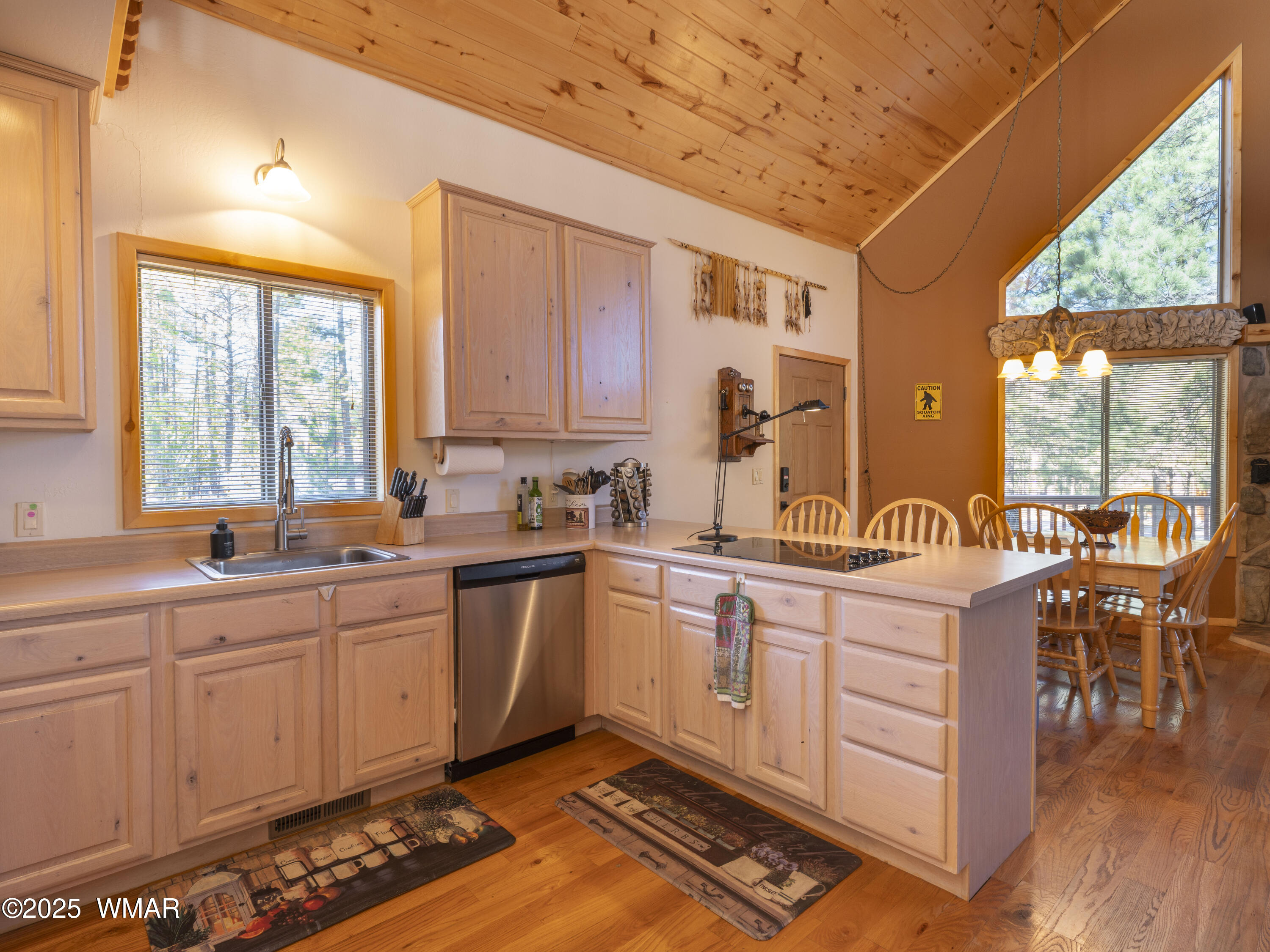 2975 Homestead Drive Overgaard, AZ 85933 - Photo 12 of 12 a kitchen with sink cabinets and wooden floor