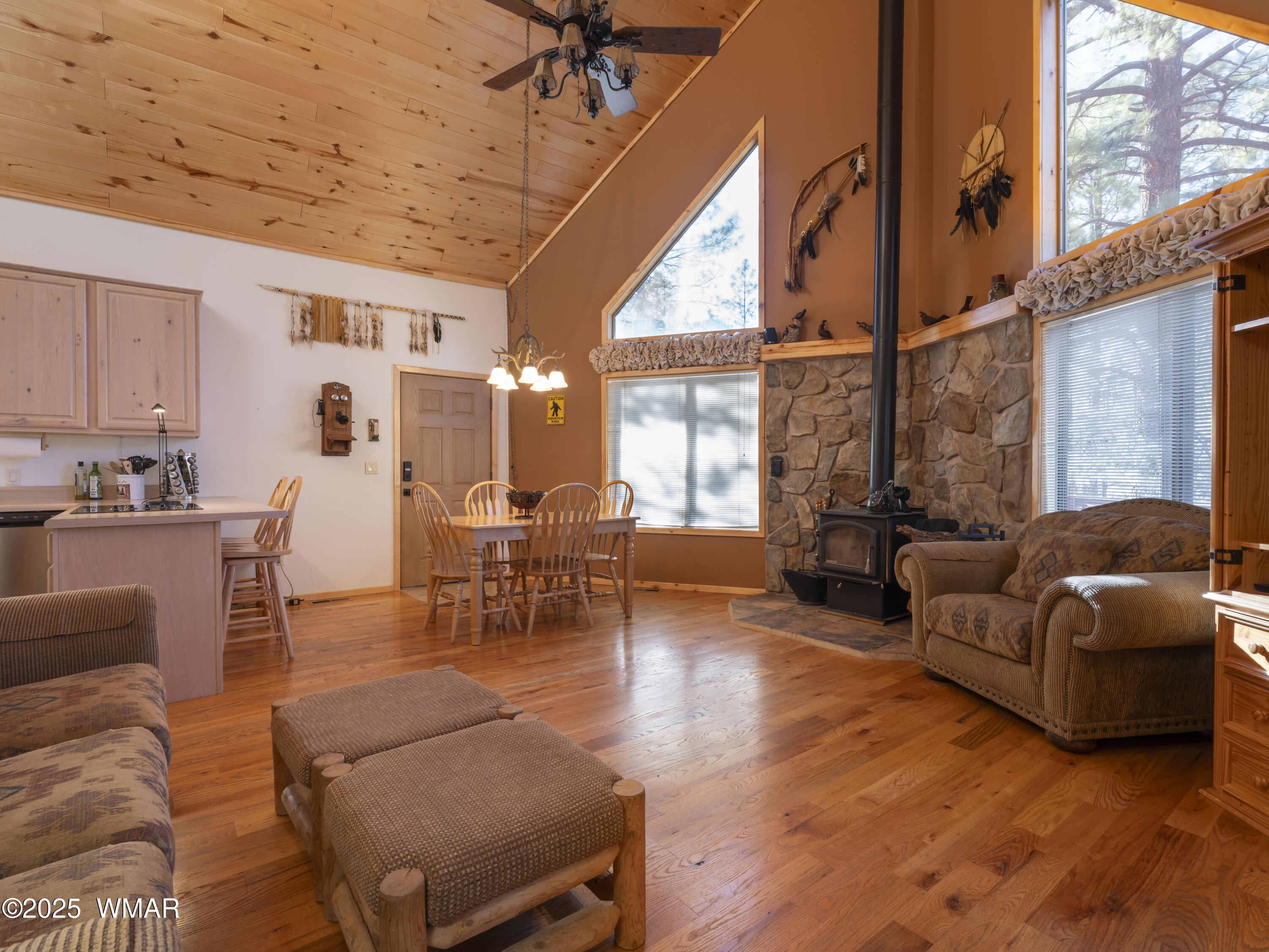 2975 Homestead Drive Overgaard, AZ 85933 - Photo 5 of 12 a living room with furniture and a large window