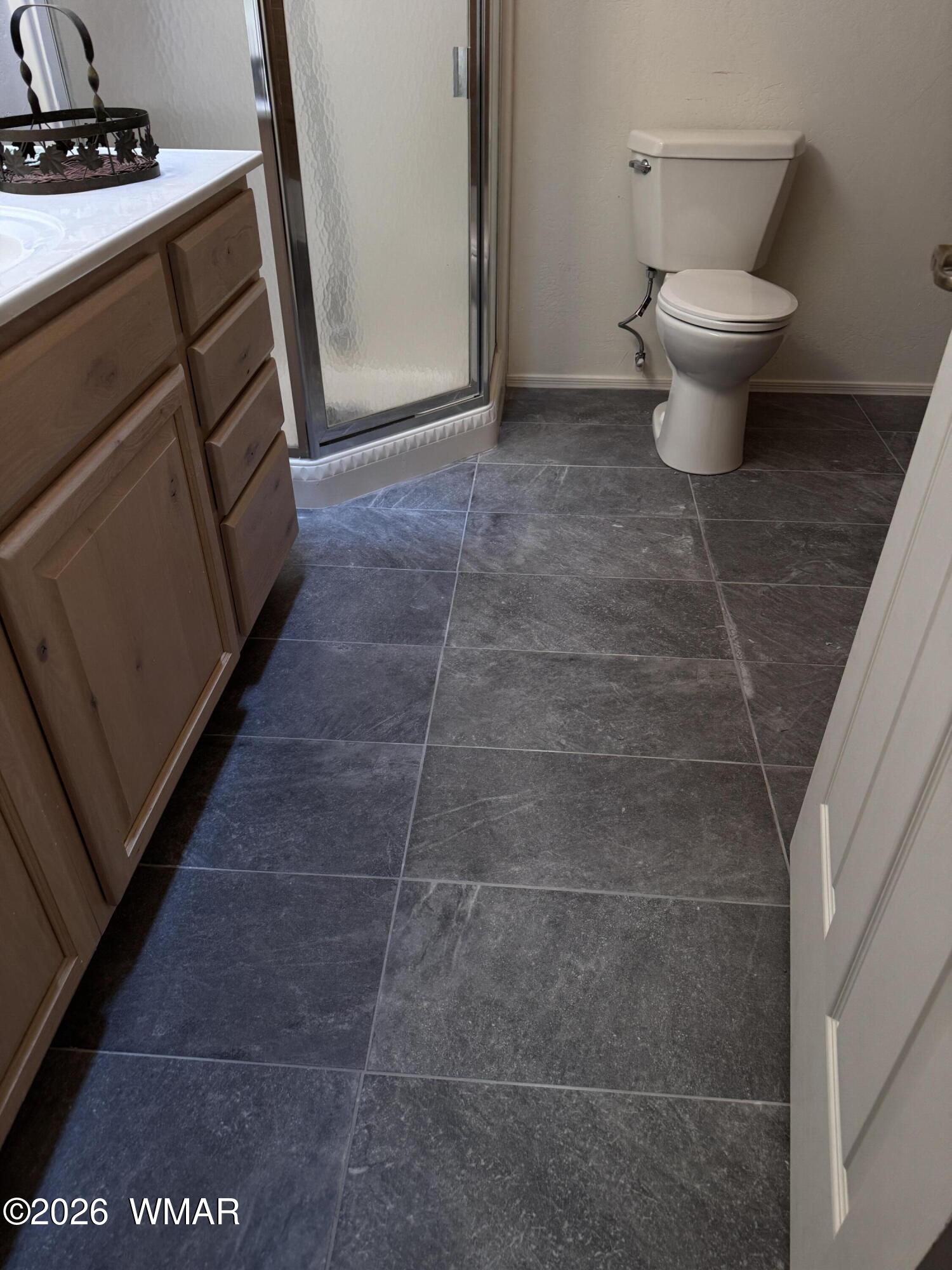 2975 Homestead Drive Overgaard, AZ 85933 - Photo 9 of 12 a bathroom with a toilet