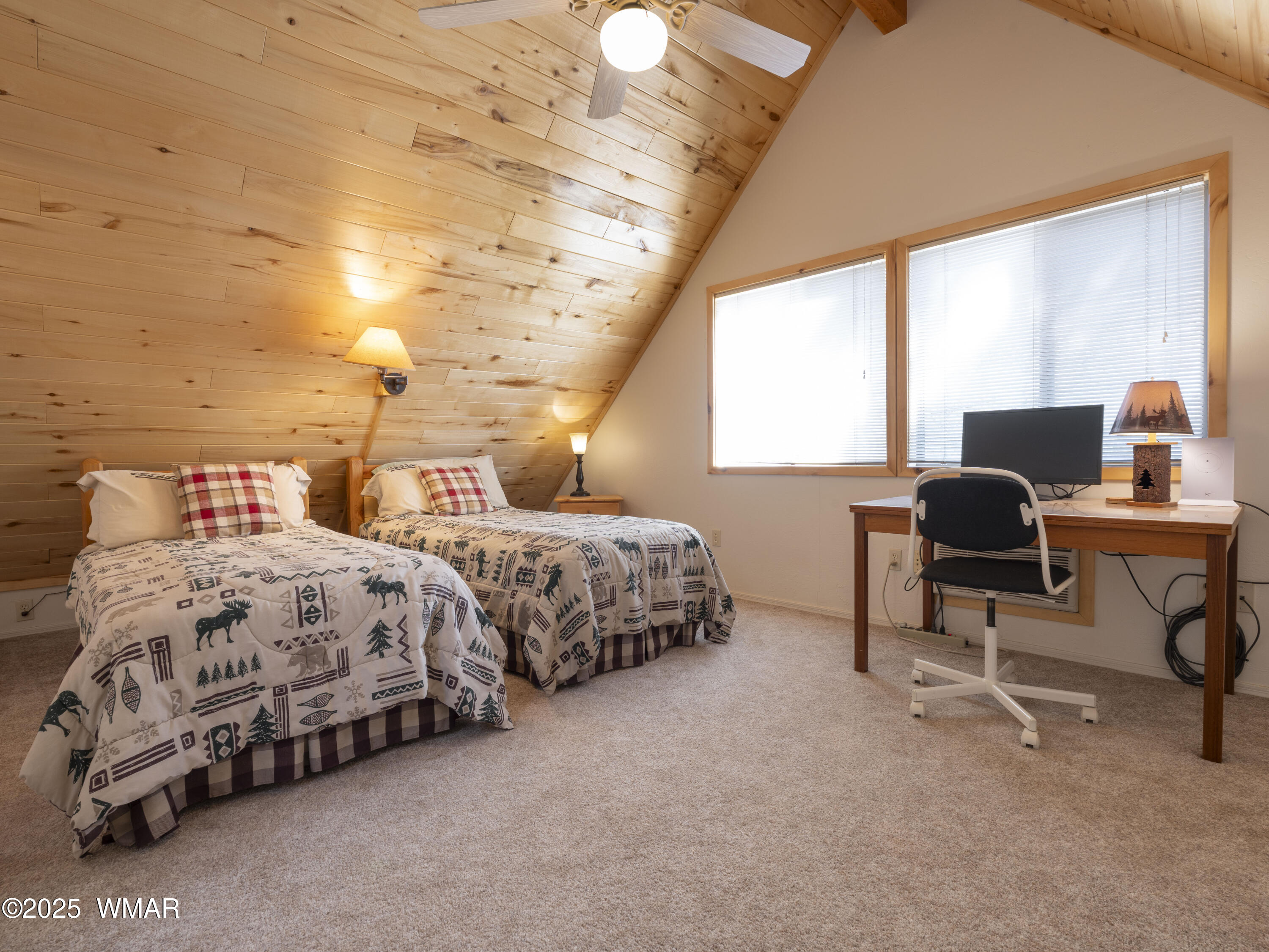 2975 Homestead Drive Overgaard, AZ 85933 - Photo 10 of 12 a bedroom with two beds and a desk