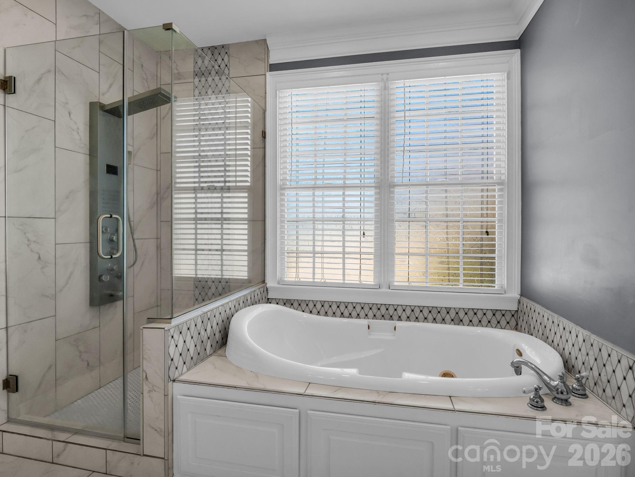139 North Woodfin Ridge Drive Inman, SC 29349 - Photo 20 of 48 a bathroom with a bathtub and shower