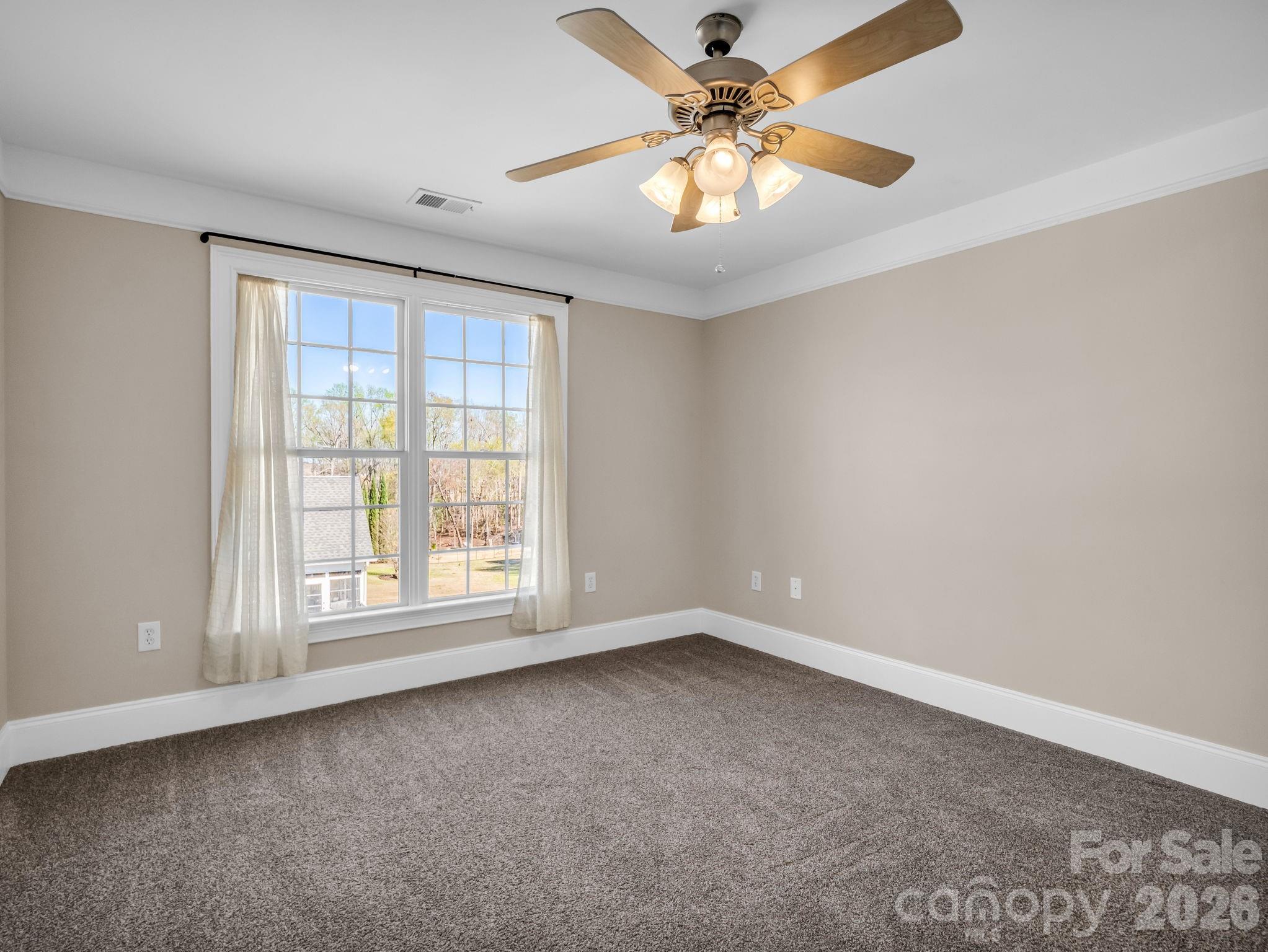 139 North Woodfin Ridge Drive Inman, SC 29349 - Photo 24 of 48 an empty room with windows and fan