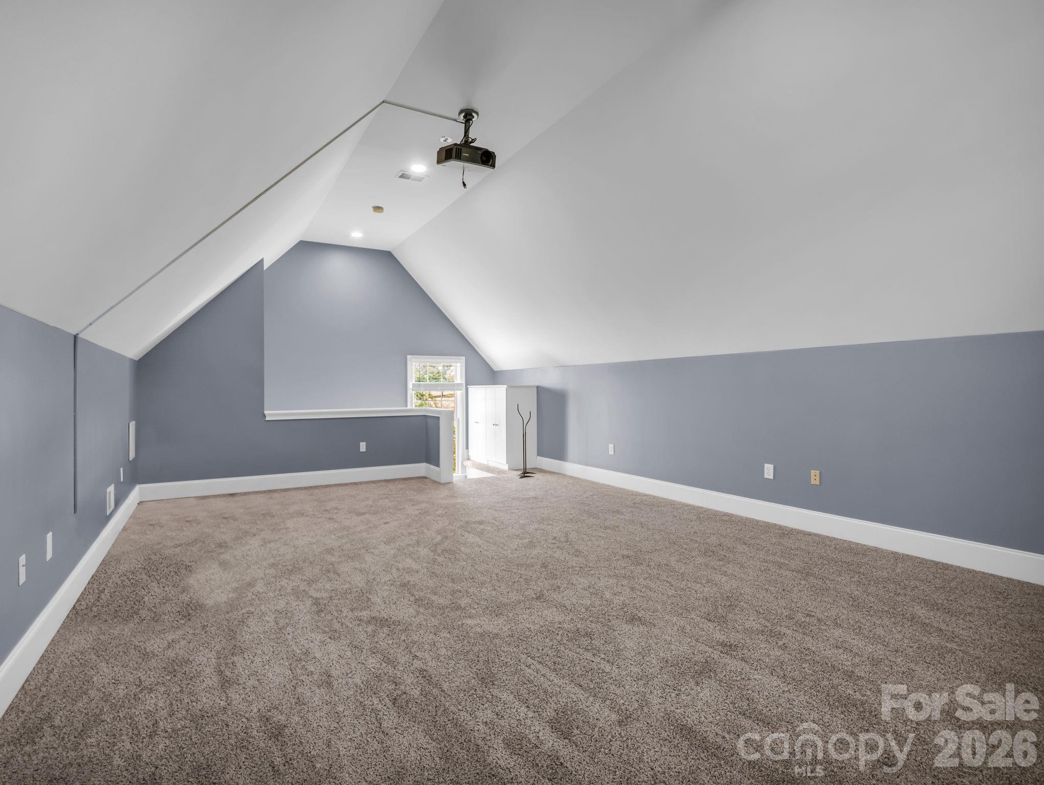 139 North Woodfin Ridge Drive Inman, SC 29349 - Photo 30 of 48 an empty room with a chandelier fan and windows