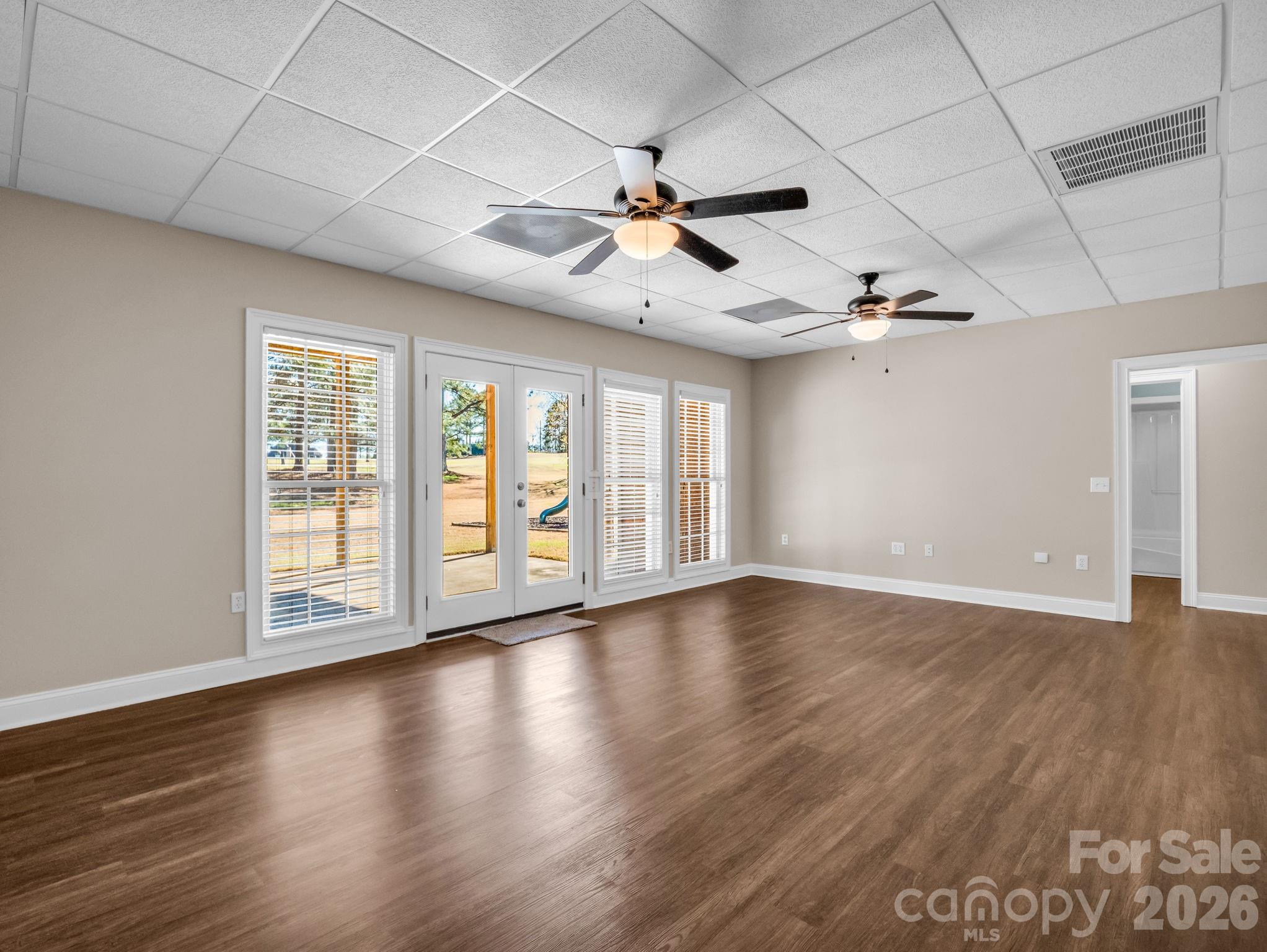 139 North Woodfin Ridge Drive Inman, SC 29349 - Photo 31 of 48 a view of an empty room with wooden floor and a window