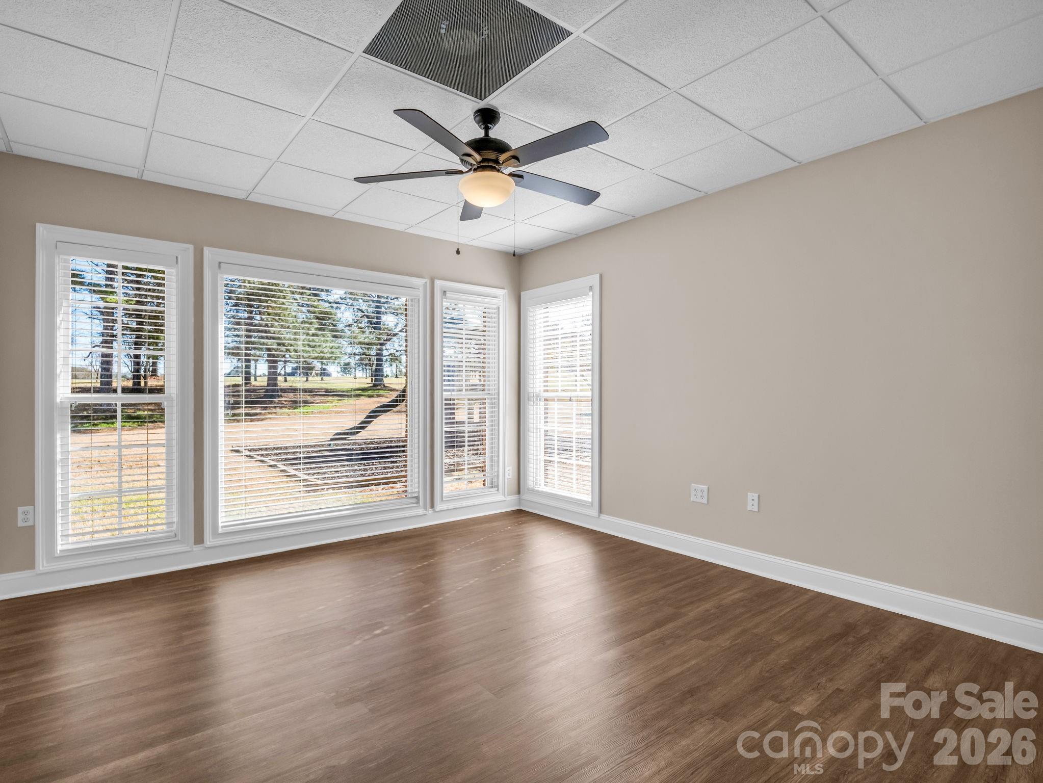 139 North Woodfin Ridge Drive Inman, SC 29349 - Photo 36 of 48 an empty room with wooden floor fan and windows