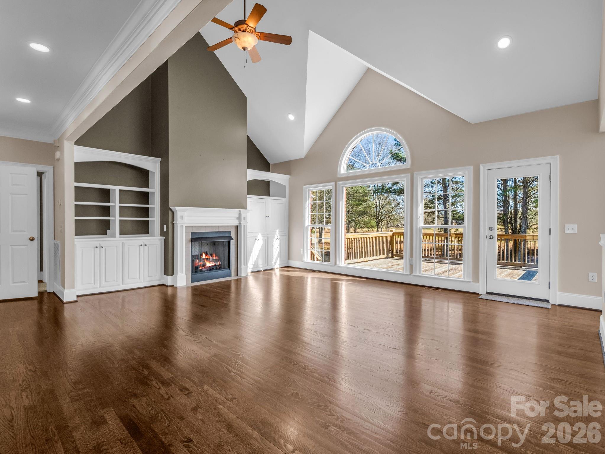 139 North Woodfin Ridge Drive Inman, SC 29349 - Photo 5 of 48 an empty room with wooden floor fan and windows