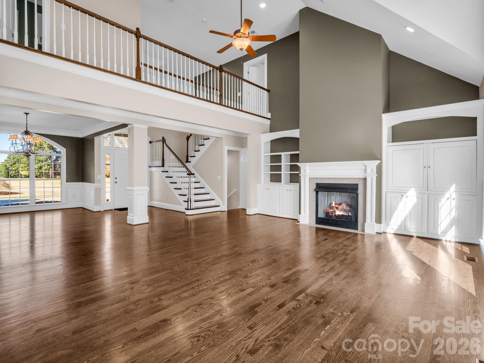 139 North Woodfin Ridge Drive Inman, SC 29349 - Photo 7 of 48 a view of an livingroom with wooden floor fireplace and a window