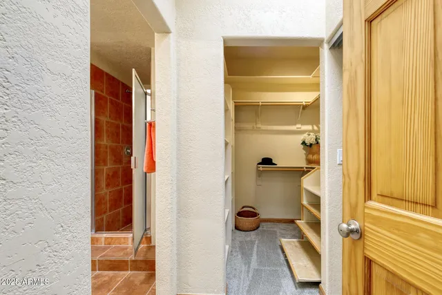 a bathroom with a sink and glass door