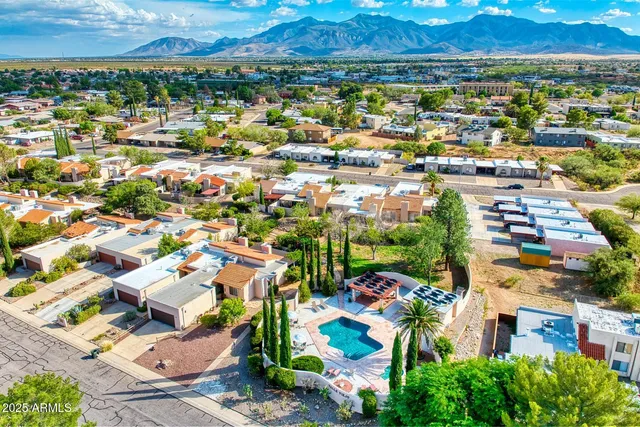 an aerial view of residential houses with outdoor space