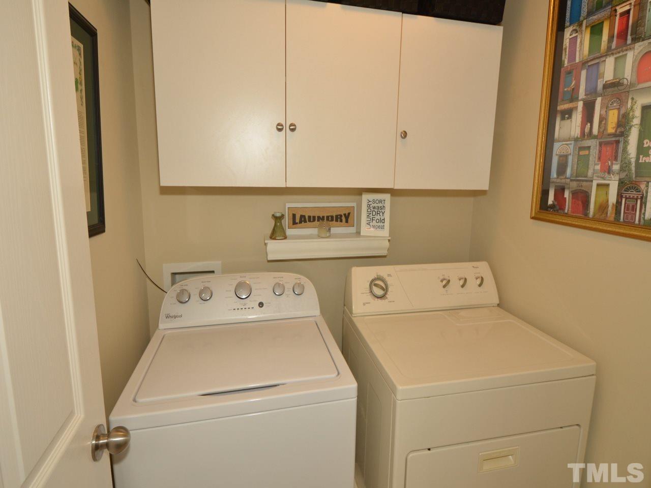 9714 Renfield Drive Raleigh, NC 27617 - Photo 16 of 25 a utility room with dryer and washer