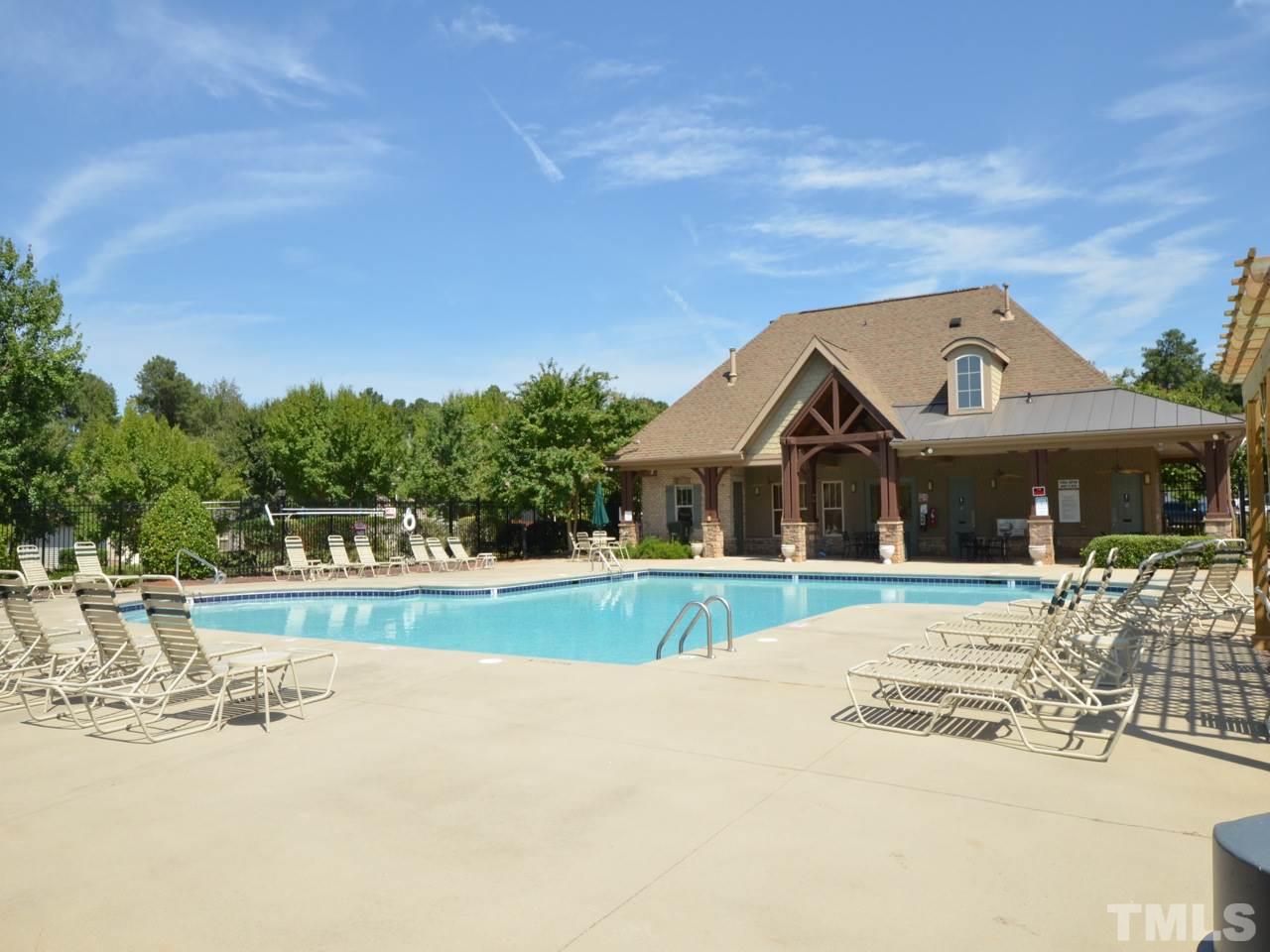 9714 Renfield Drive Raleigh, NC 27617 - Photo 22 of 25 a front view of a house with a yard