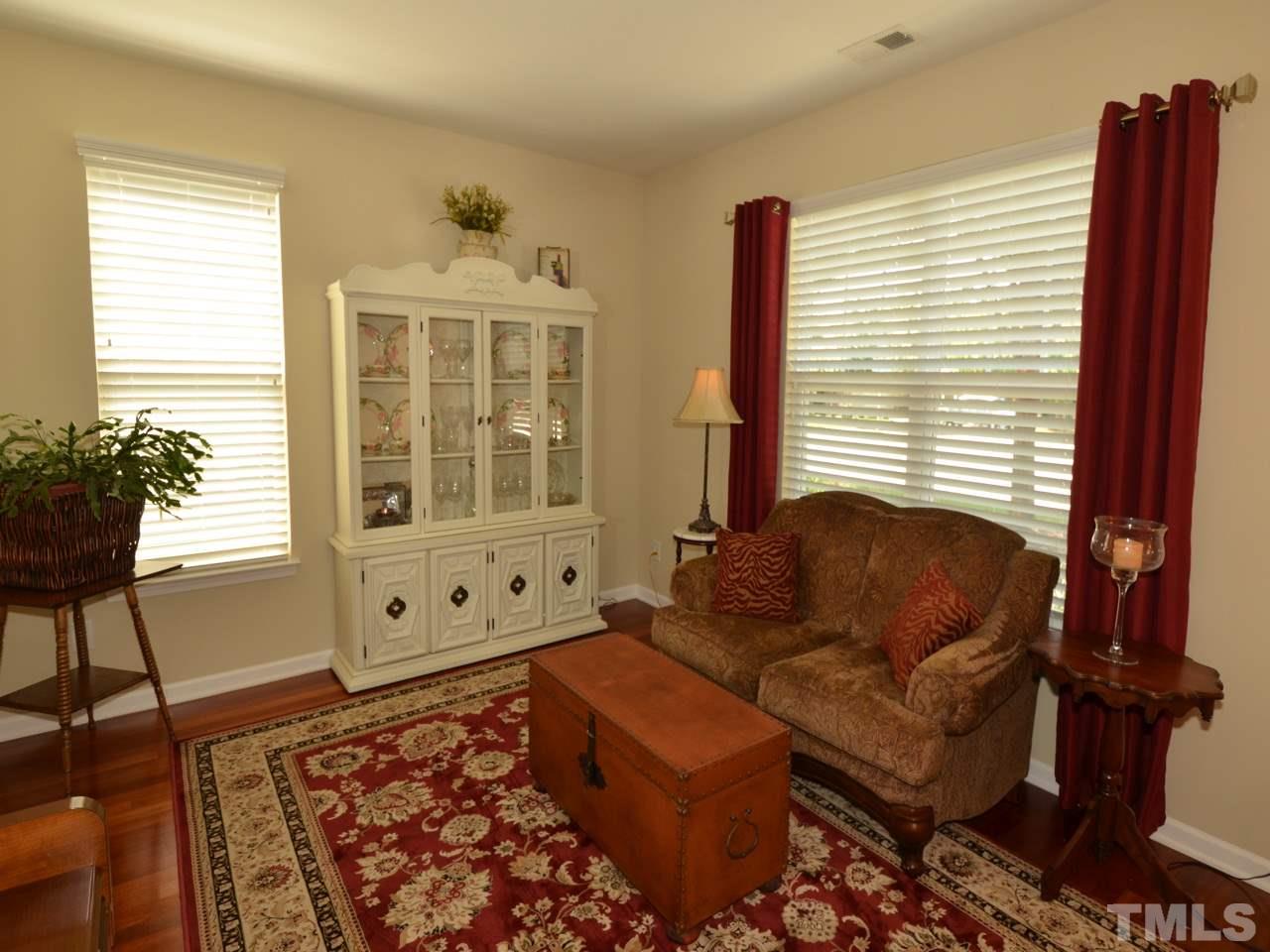 9714 Renfield Drive Raleigh, NC 27617 - Photo 23 of 25 a living room with furniture and a window