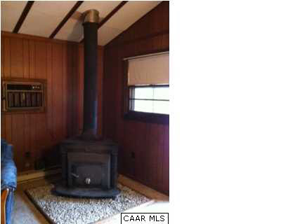 2188 Middle River Road Stanardsville, VA 22973 - Photo 4 of 13 a living room with furniture and a fireplace