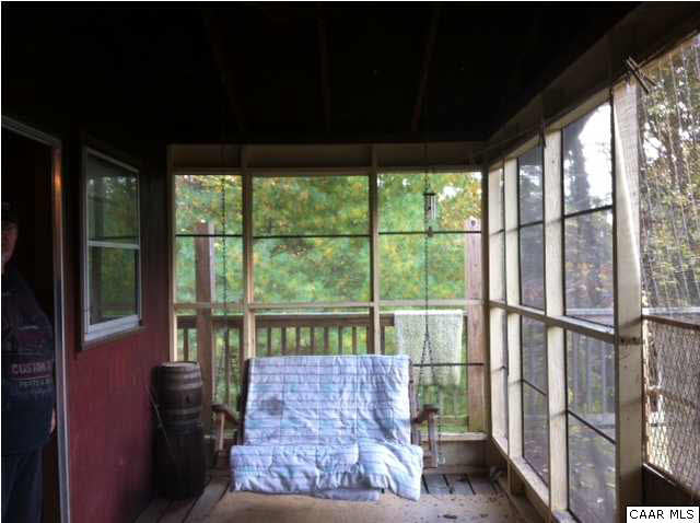 2188 Middle River Road Stanardsville, VA 22973 - Photo 9 of 13 a view of a porch with a floor to ceiling window