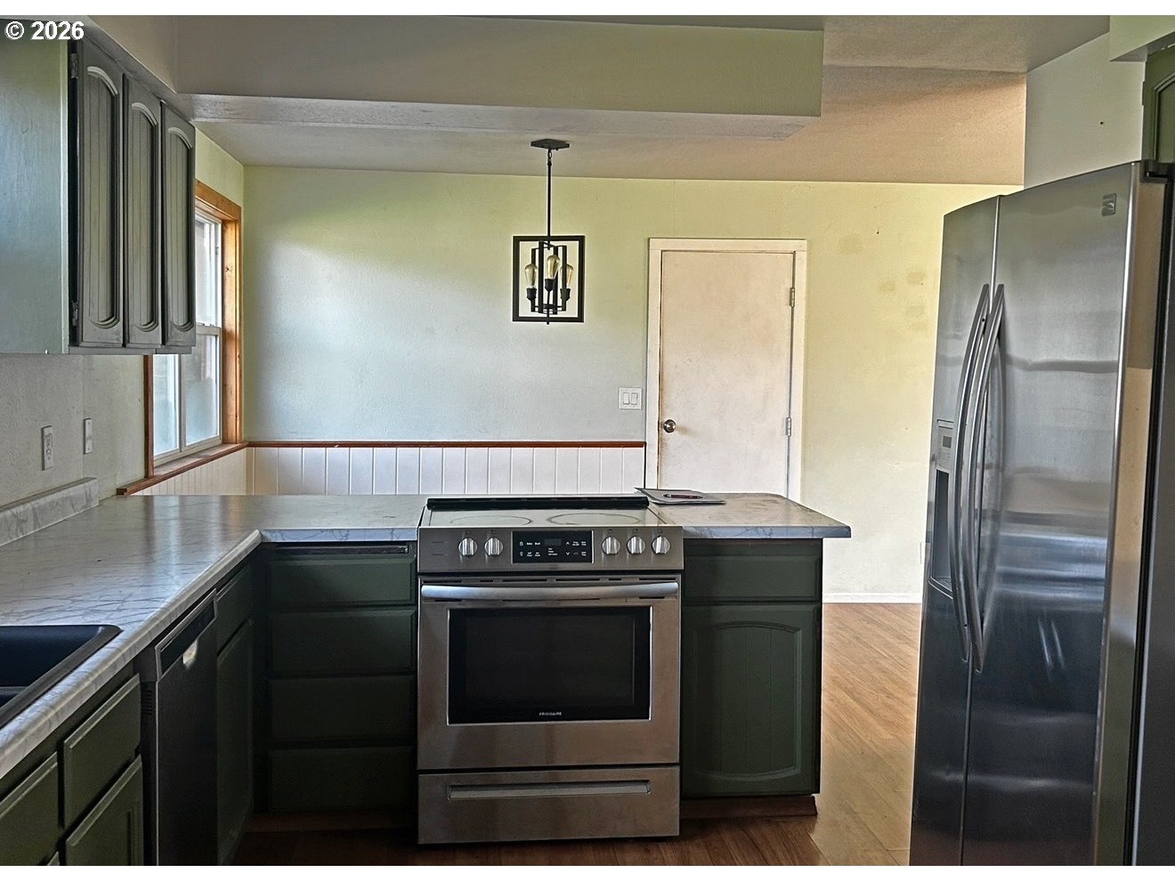 28218 Mateer Road Gold Beach, OR 97444 - Photo 12 of 20 a kitchen with stainless steel appliances granite countertop a refrigerator and a stove
