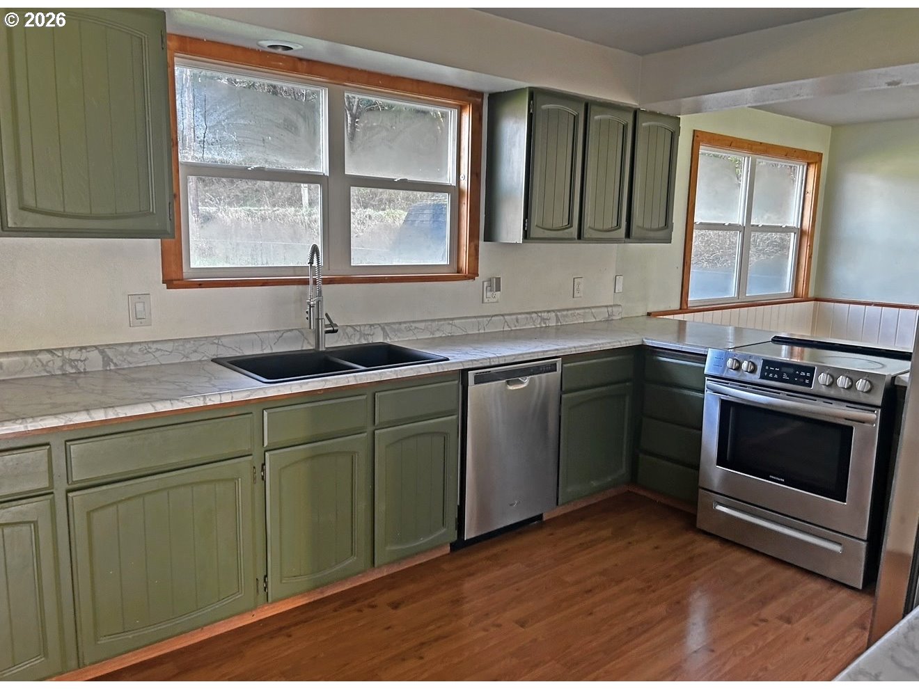 28218 Mateer Road Gold Beach, OR 97444 - Photo 13 of 20 a kitchen with a sink stove and cabinets