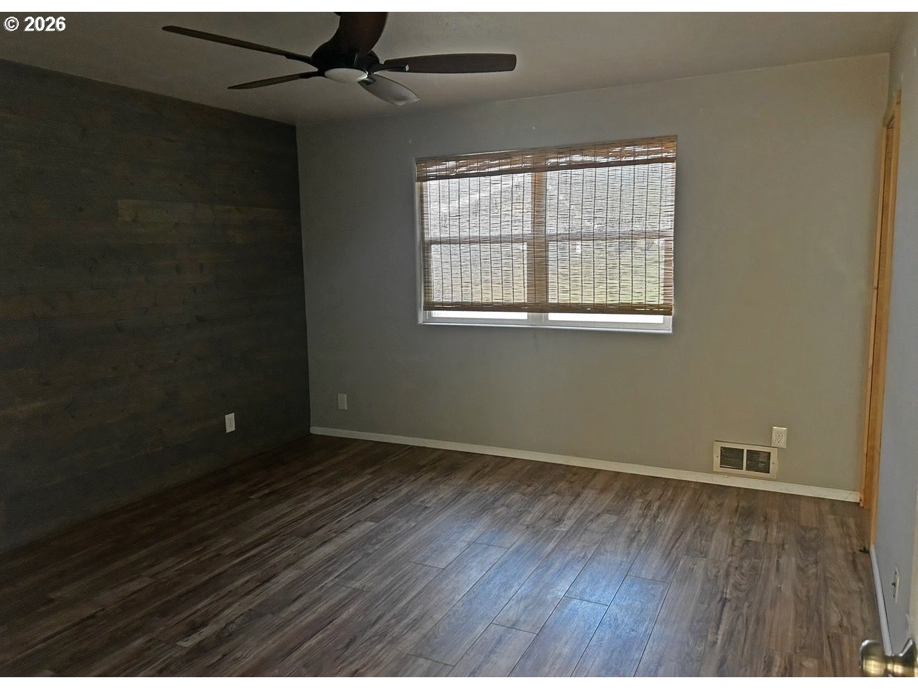 28218 Mateer Road Gold Beach, OR 97444 - Photo 16 of 20 a view of an empty room with wooden floor and a window