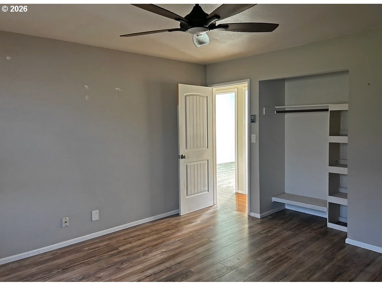 28218 Mateer Road Gold Beach, OR 97444 - Photo 17 of 20 an empty room with wooden floor closet and windows