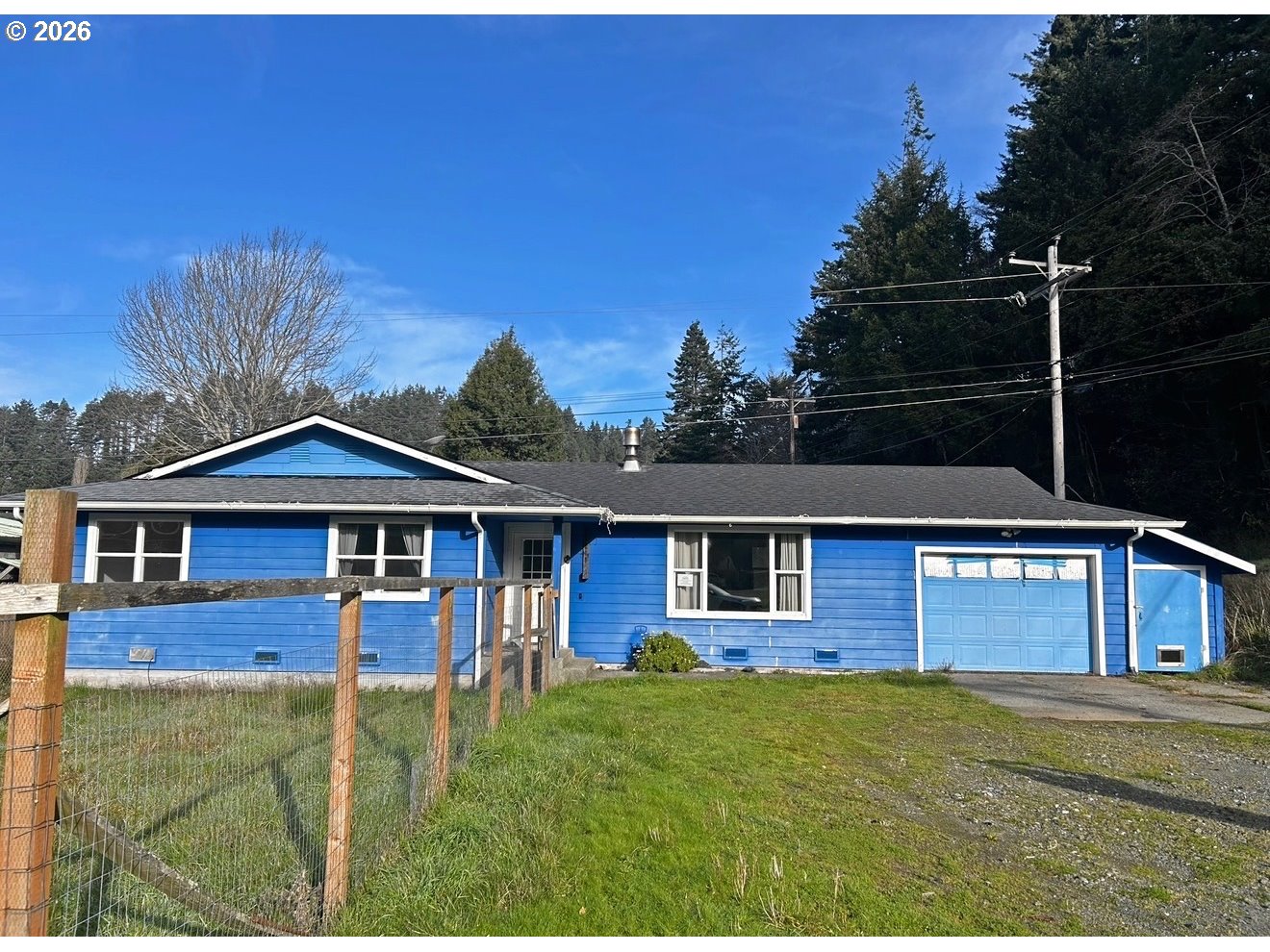 28218 Mateer Road Gold Beach, OR 97444 - Photo 2 of 20 a front view of a house with a yard