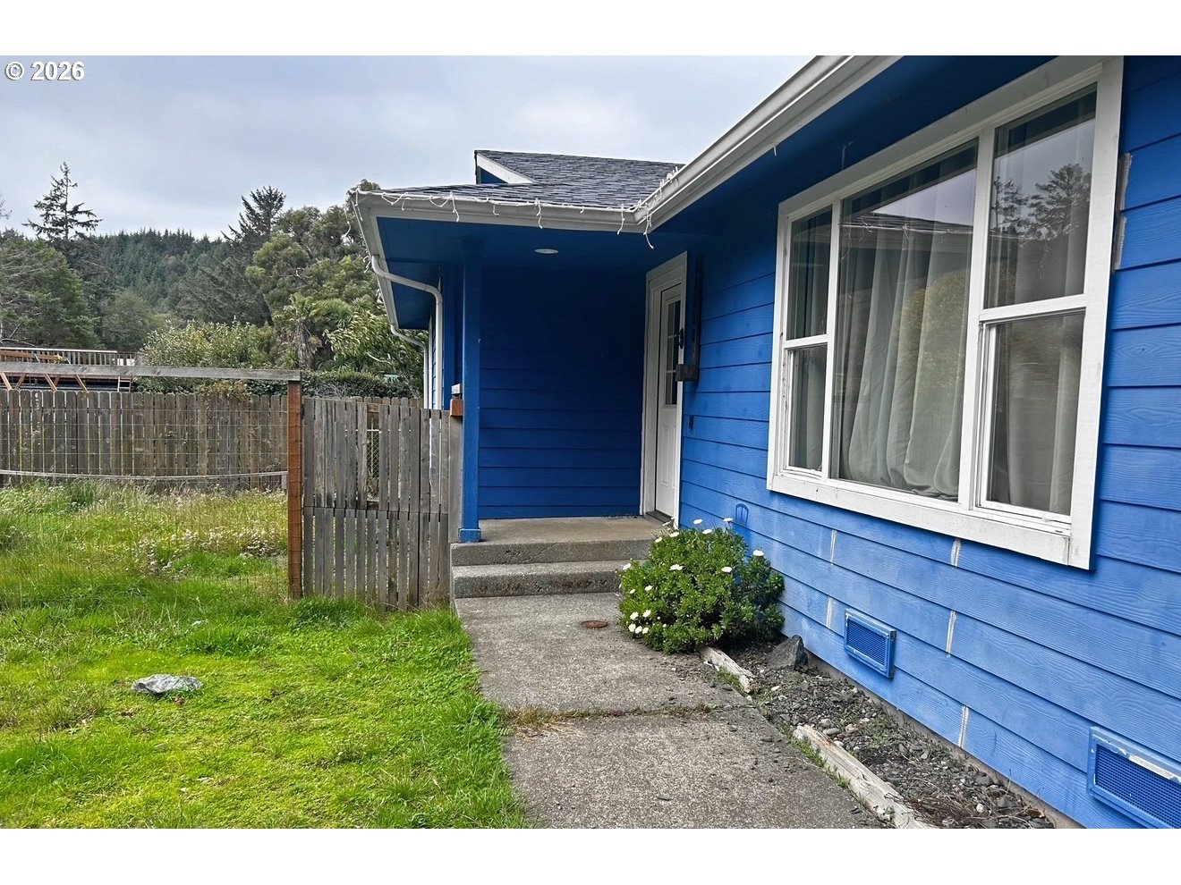 28218 Mateer Road Gold Beach, OR 97444 - Photo 3 of 20 a house view with a garden space
