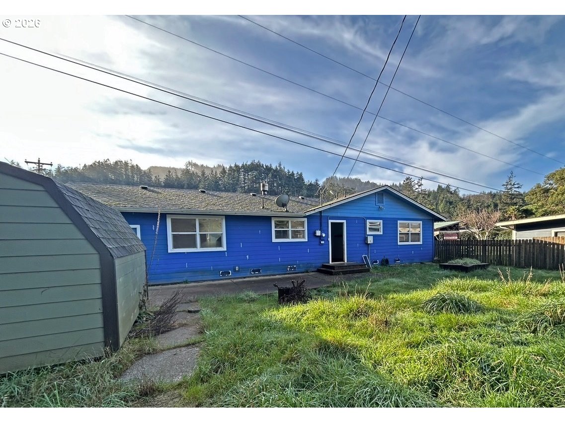 28218 Mateer Road Gold Beach, OR 97444 - Photo 6 of 20 a view of a house with a yard