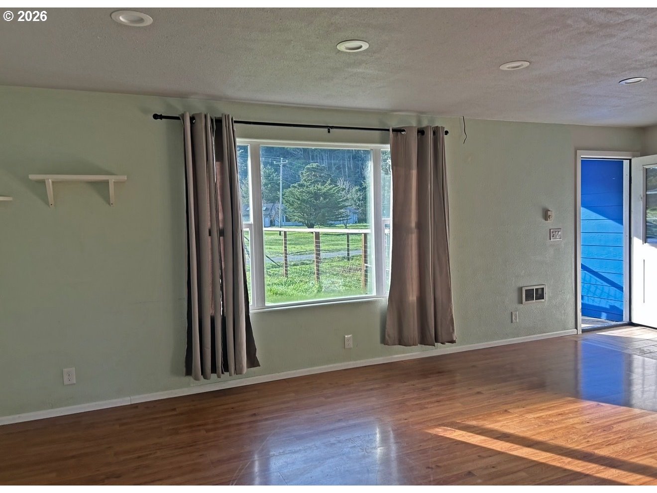 28218 Mateer Road Gold Beach, OR 97444 - Photo 8 of 20 a view of an empty room with a window