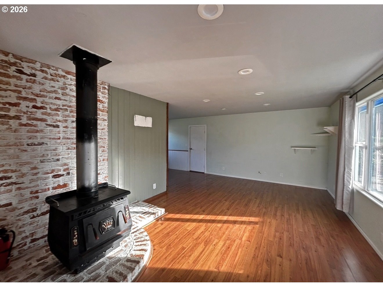 28218 Mateer Road Gold Beach, OR 97444 - Photo 9 of 20 a living room with a couch and a fireplace