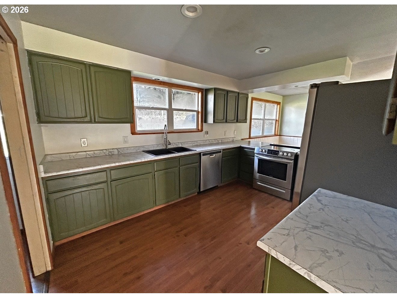 28218 Mateer Road Gold Beach, OR 97444 - Photo 10 of 20 a kitchen with sink a microwave and refrigerator
