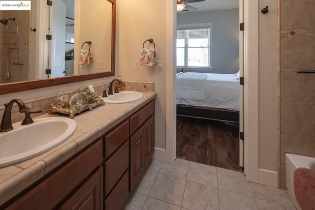 a bathroom with a sink a mirror and a toilet