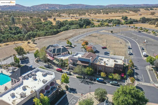 an aerial view of a house with outdoor space