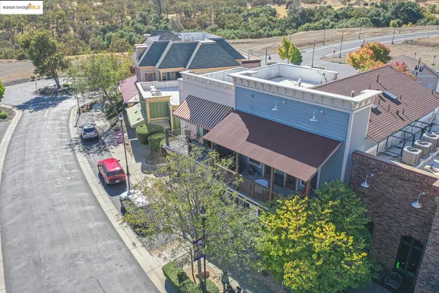 an aerial view of a house with a yard and a garden