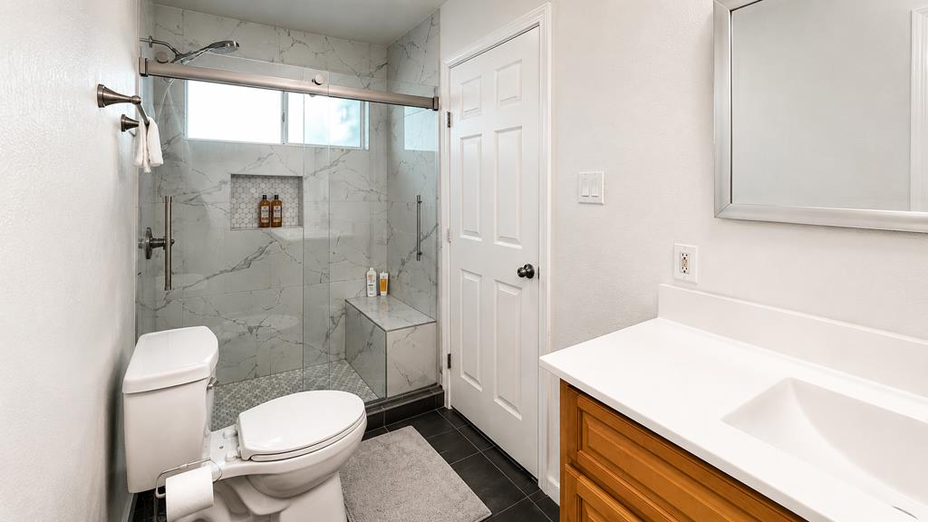 1281 Traynor Road Concord, CA 94520 - Photo 30 of 41 a bathroom with a sink a toilet and shower