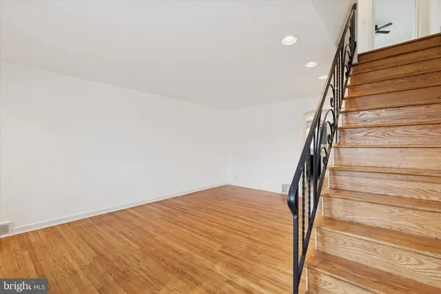 a kitchen with a refrigerator and windows