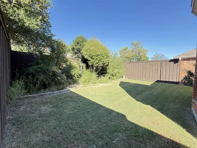a view of a yard with an outdoor space