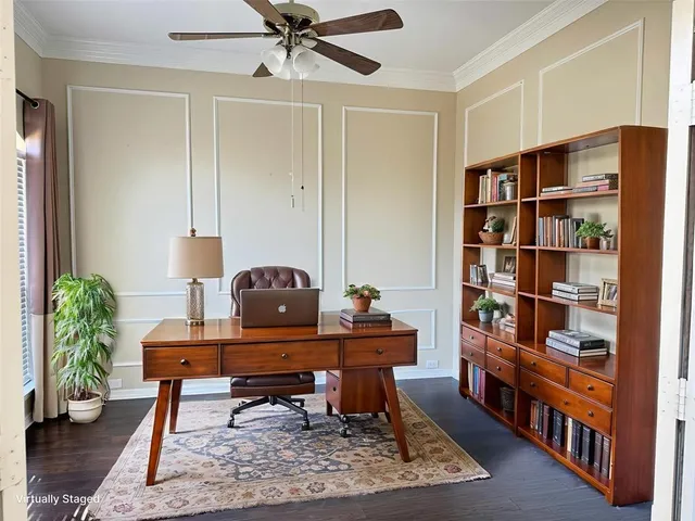 a living room with furniture and a book shelf
