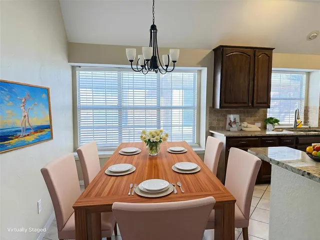 a view of a dining room with furniture