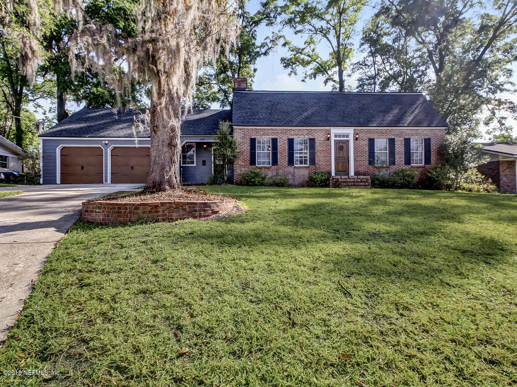 1041 Glen Echo Road Jacksonville, FL 32211 - Photo 1 of 40 a front view of a house with a garden